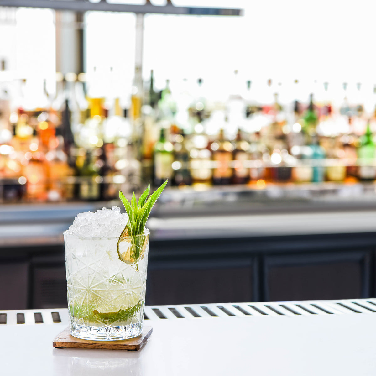 Zanzi Square Coaster Natural Acacia 4pc Set Lifestyle Tomkin Australia Hospitality Supplies